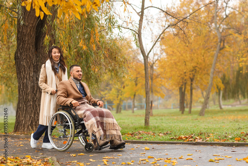 Young man in wheelchair wit...
