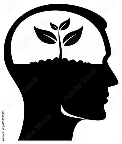 Silhouette of a human head with a plant growing from soil within the mind symbolizing growth and new ideas