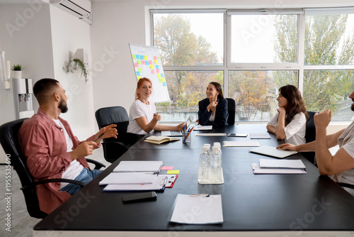 Group of young people discu...