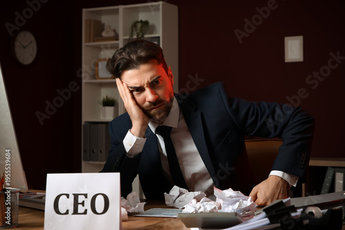 Angry businessman at desk i...