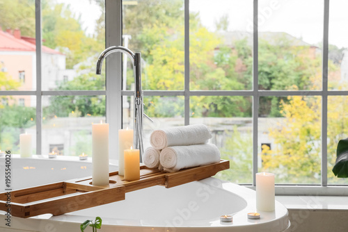 Tray with burning candles a...