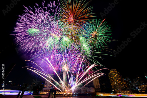 colourful firework display set for celebration happy new year and merry christmas at Bangkok River Beautiful backdrop and lighting of famous Bangkok landmark, Thailand
