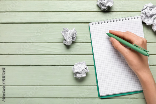 Notebook and crumpled piece...