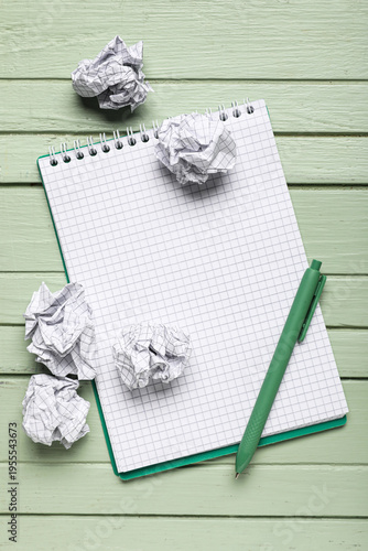 Notebook and crumpled piece...