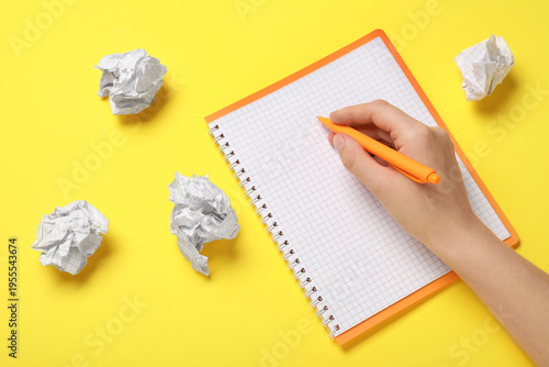 Female hand with notebook a...