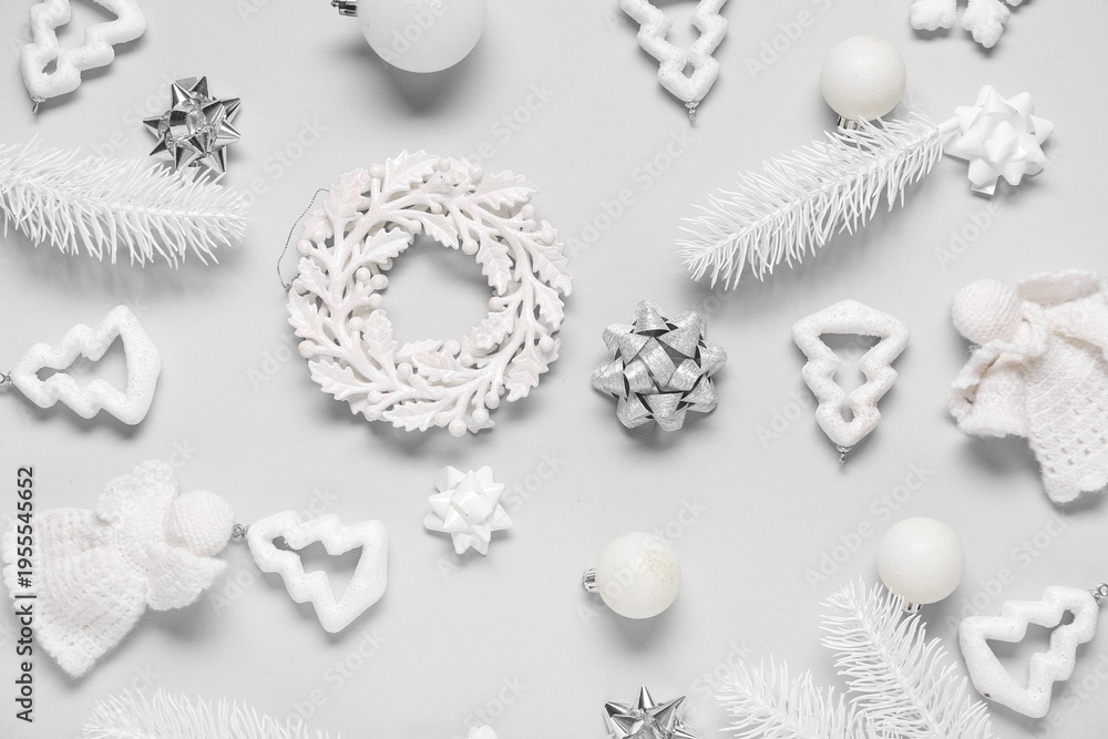 Obraz premium Composition with Christmas balls, knitted angels and decorative snowflakes on white background