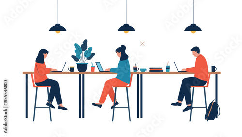 Group of freelancers working on laptops while sitting at a long table in a modern co-working space with industrial hanging lamps.