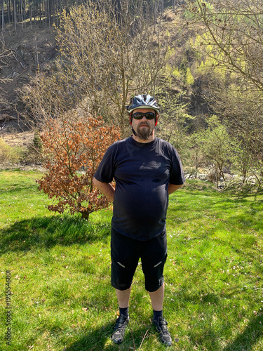 young man biking in the forest