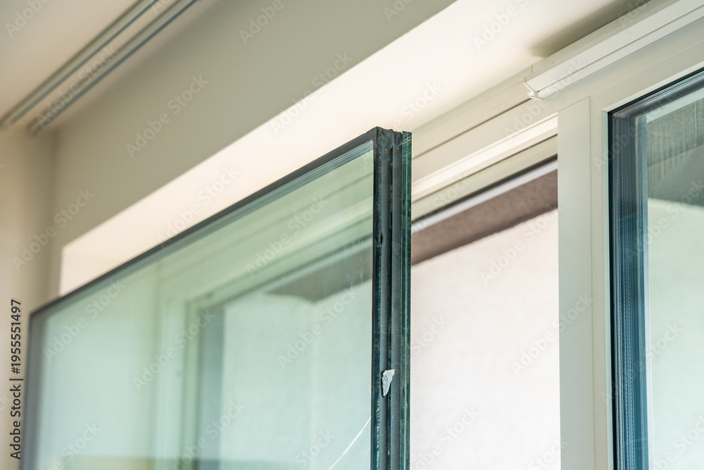 Αυτοκόλλητο Removed triple glazed window glass unit leaning near frame after replacement in apartment