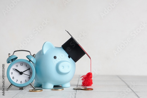 Piggy bank with graduation ...