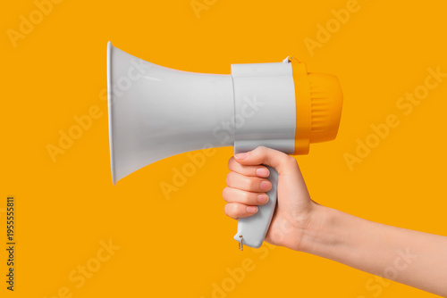 Female hand with megaphone ...
