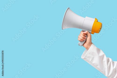 Female hand with megaphone ...