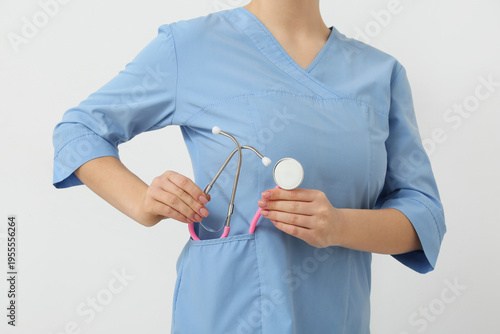 Female doctor putting steth...