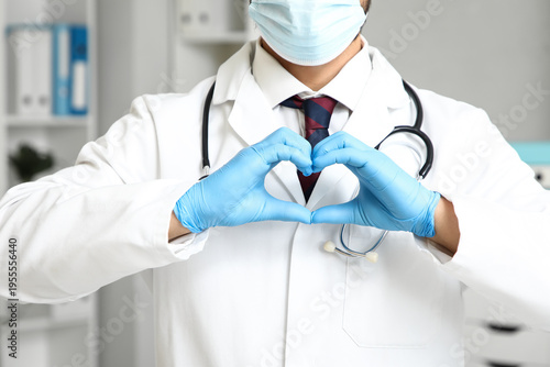 Young male doctor with prot...