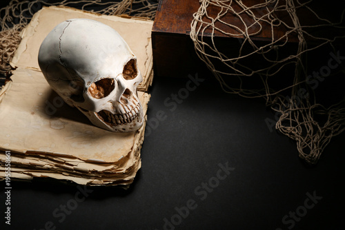 Human skull with old book, ...