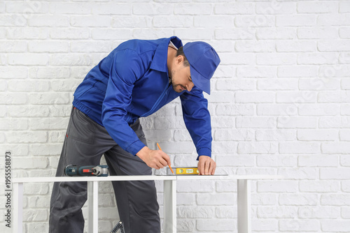 Male technician repairing s...