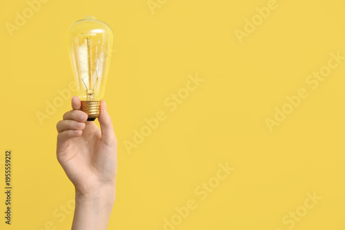 Female hand with light bulb...