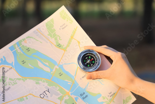 Woman with compass and map ...