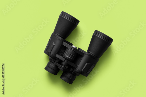 Travel binoculars on green ...