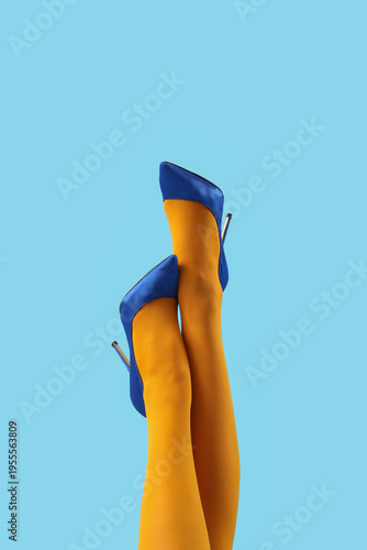 Female legs in stylish high...