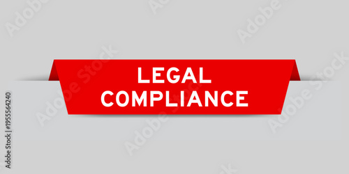 Red color inserted label with word legal compliance on gray background
