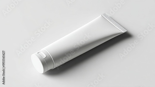 A minimalist white tube, possibly for skincare, placed on a light background. A tube box mockup