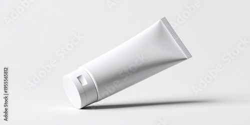 A sleek white tube, possibly for skincare, displayed on a minimalist background. A tube box mockup