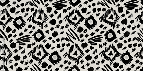 Abstract black and white pattern resembling animal print with irregular shapes