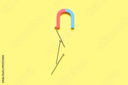 Magnet attracting nails on ...