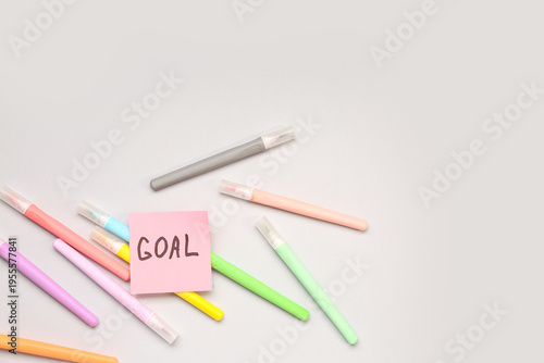 Sticky note with word GOAL ...