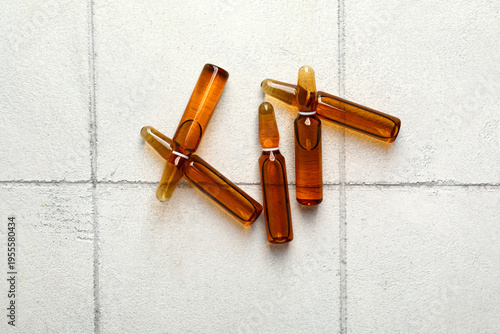 Medical ampules on white ti...