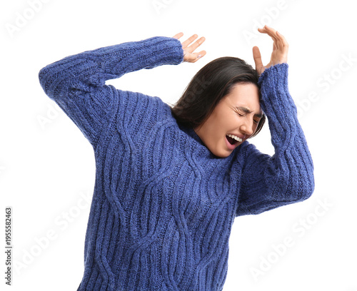 Scared young woman on white...