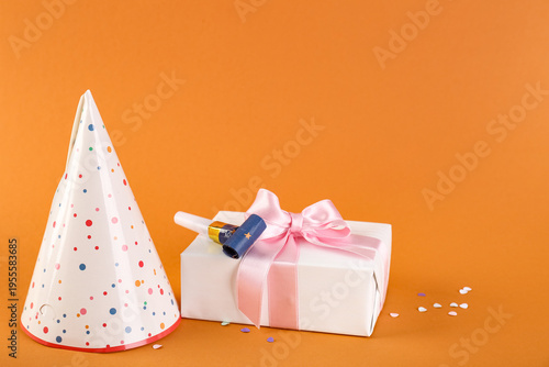 Party hat, gift box and whi...