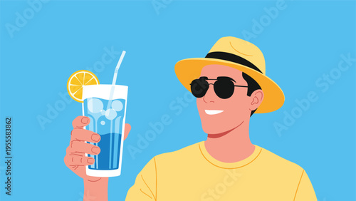 Happy young man wearing a hat and sunglasses holding a refreshing blue summer cocktail with a lemon slice on a blue background.