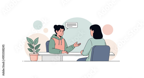 Job Interview or Meeting: Two People Talking at Desk with Plant and Soft Circles