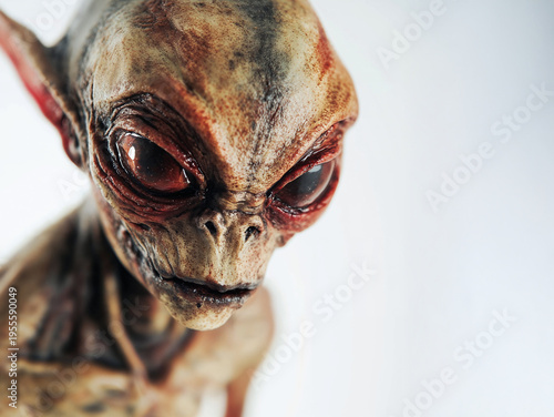 Close up horror alien with red eyes and damaged skin texture on white background