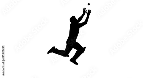 Man jumping to catch a ball in mid air silhouette