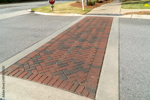 Quadro em tela Vibrant herringbone brick paver crosswalk featuring red and dark grey tones, pro
