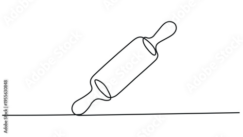 A rolling pin resting on a flat surface with two oval handles