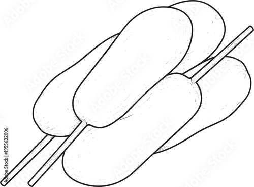 Three skewers hold a stack of Japanese mochi ice cream. The ice cream is light brown and has a smooth texture.