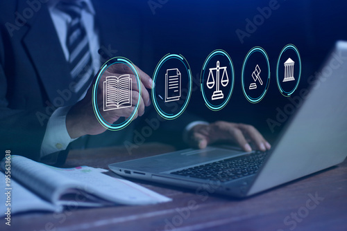 Man use laptop with pen interacts with digital icons representing law and justice, symbolized by a scale, Justice, and Legal services. Business legislation, Notary public, Legal advice online, Lawyer