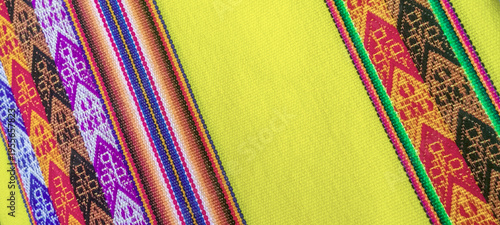 Colorful background of traditional textile fabric, Peru, Latin America, Colorful typical Peruvian hand-woven fabric.