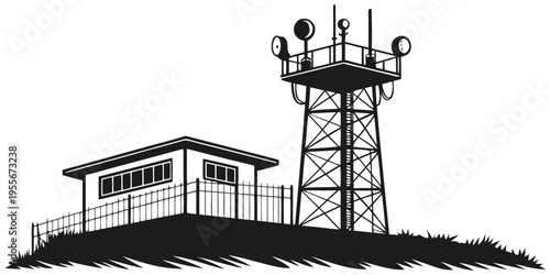 A small building with a fenced yard and a tall tower