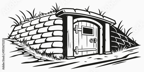 A small stone hut with a wooden door and grass on the roof