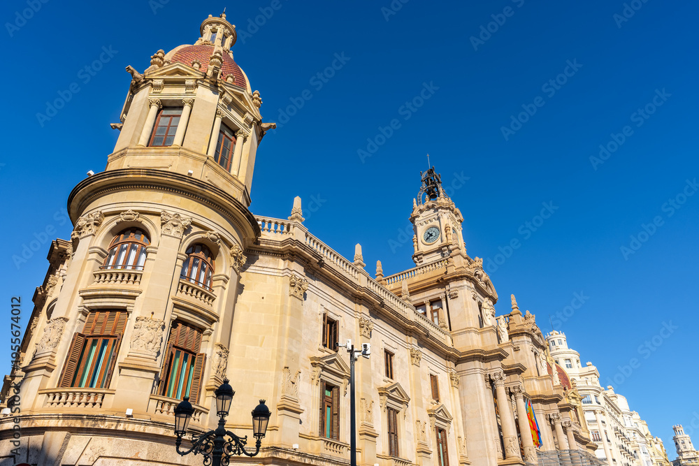 Obraz premium Tower of the classic building of the city hall of Valencia on a sunny day with blue skies, Spain.