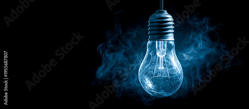 A luminous, transparent bulb hangs centered in the dark space, encased in swirling, ethereal, blue vapor. The filament inside is faintly visible