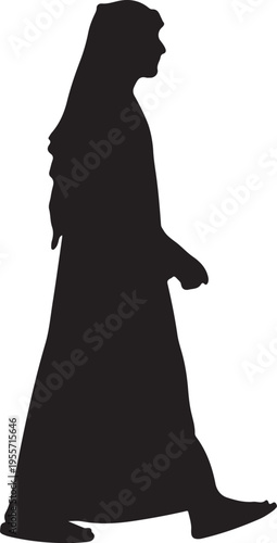 Silhouette of a person walking in a long flowing robe and head covering