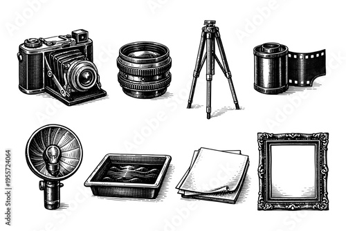 Vintage photography equipment collection, including camera, lens, tripod, film, flash, tray, paper, and frame
