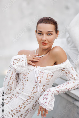 Beautiful Woman in Lace Dress Touching Necklace in Elegant Close-Up Shot
