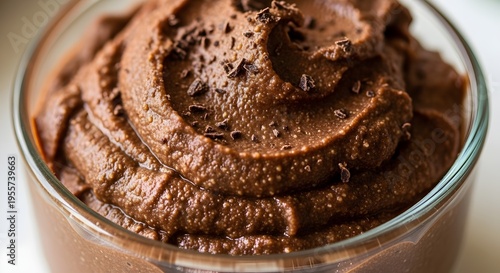 Close up of chocolate mousse dessert in a glass bowl with chocolate shavings on top perfect for food blogs and recipe websites